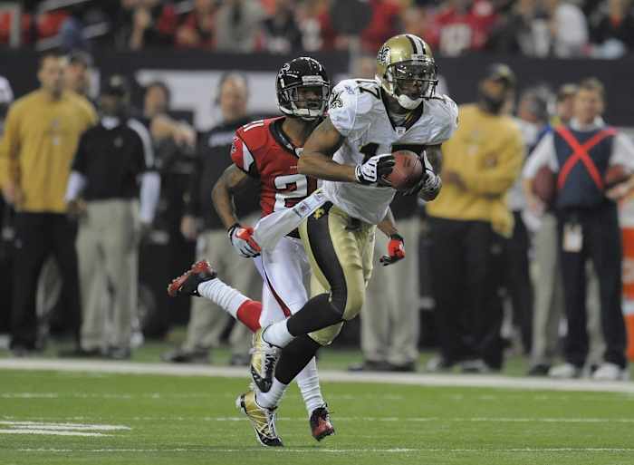Dec 13, 2009; New Orleans Saints receiver Robert Meachem catches a pass behind Falcons cornerback Chris Owens. Mandatory Credit: Dale Zanine-USA TODAY Sports